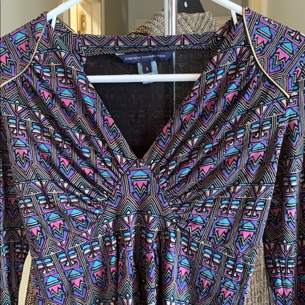 V neck top. Stretch and very comfortable.